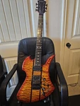 B.c. Rich Electric Guitar Orange Solid Body 6 String Quilted Maple Top. Fixed Price $780.00.